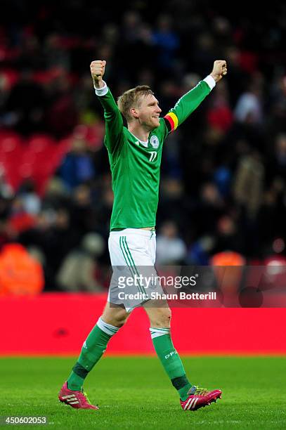 Per Mertesacker of Germany celebrates his team's 1-0 victory during the international friendly match between England and Germany at Wembley Stadium...