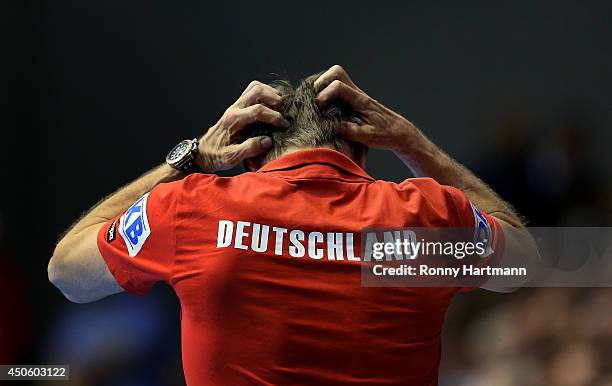 Head coach Martin Heuberger of Germany reacts during the IHF World Championship 2015 Playoff Leg Two between Germany and Poland at Getec-Arena on...