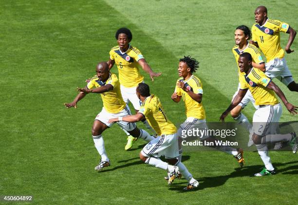Pablo Armero of Colombia celebrates with teammates after scoring his team's first goal during the 2014 FIFA World Cup Brazil Group C match between...