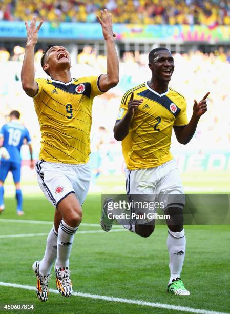 Teofilo Gutierrez of Colombia celebrates scoring his team's second goal with Cristian Zapata during the 2014 FIFA World Cup Brazil Group C match...