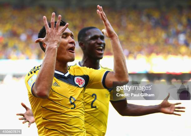 Teofilo Gutierrez of Colombia celebrates scoring his team's second goal with Cristian Zapata during the 2014 FIFA World Cup Brazil Group C match...