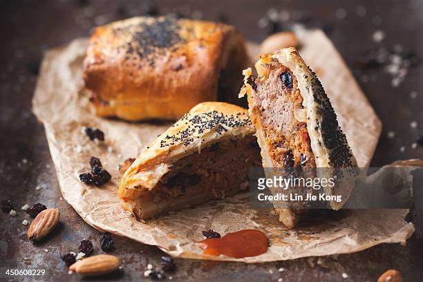 lamb, almond and harissa sausage rolls - sausage roll stock-fotos und bilder