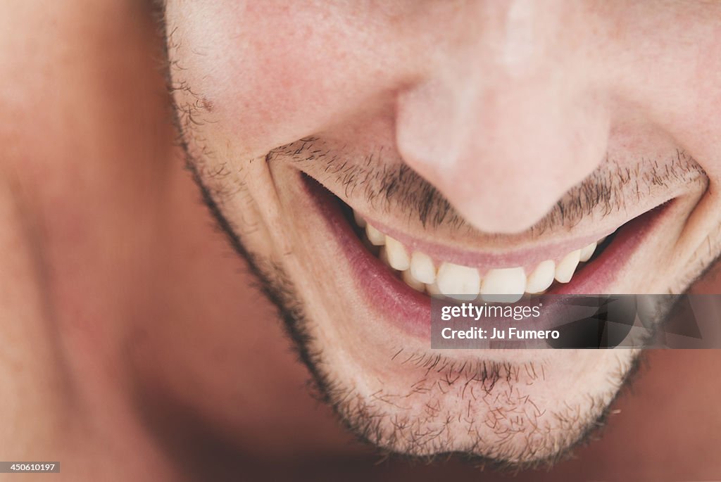 Smile of a man with beard