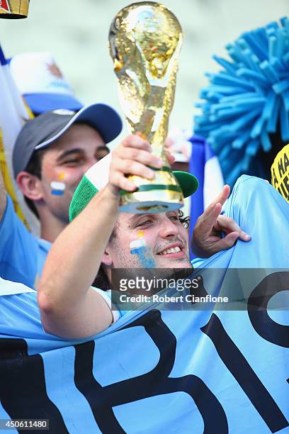 Uruguay fan cheers while holding a replica of the World Cup Trophy prior to the 2014 FIFA World Cup Brazil Group D match between Uruguay and Costa...