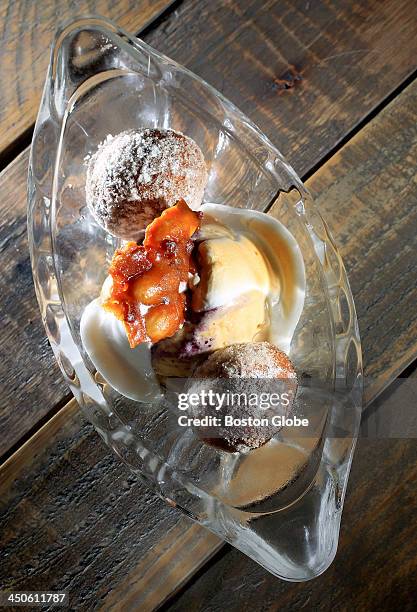 House made dessert with peanut butter and concord grape jelly, ice cream, vanilla sugar donuts, toasted fluff, and bacon almond brittle at new...