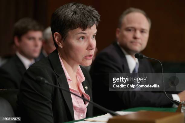 Financial Crimes Enforcement Network Director Jennifer Calvery and Massachusetts Division of Banks Commissioner of Banks David Cotney testify before...