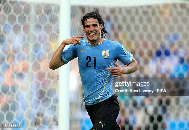 Edinson Cavani of Uruguay celebrates after scoring from the penalty spot during the 2014 FIFA World Cup Brazil Group D match between Uruguay and...