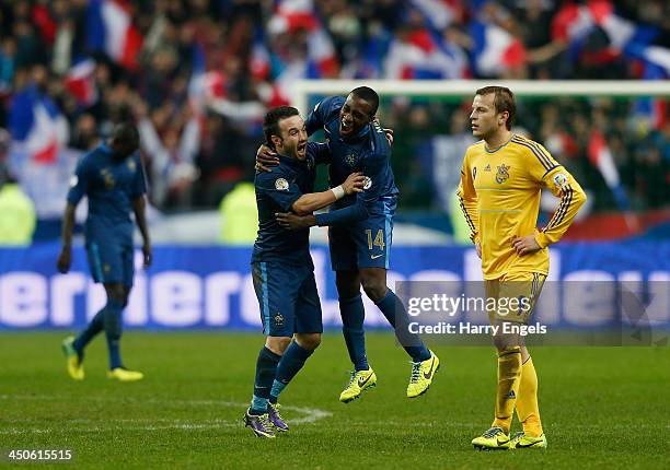 Blaise Matuidi and Mathieu Valbuena of France celebrate at the end of the match as Oleg Guslev of Ukraine looks on during the FIFA 2014 World Cup...