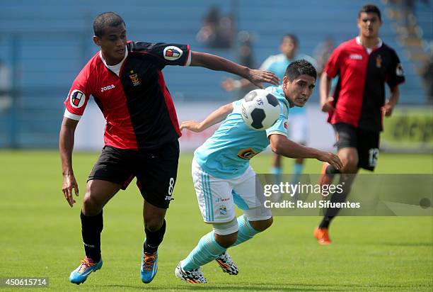 Irven Avila of Sporting Cristal struggles for the ball with Nelinho Quina of FBC Melgar during a match between Sporting Cristal and FBC Melgar as...