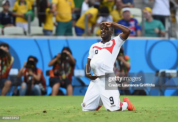Joel Campbell of Costa Rica celebrates scoring his team's first goal with the ball under his jersey during the 2014 FIFA World Cup Brazil Group D...
