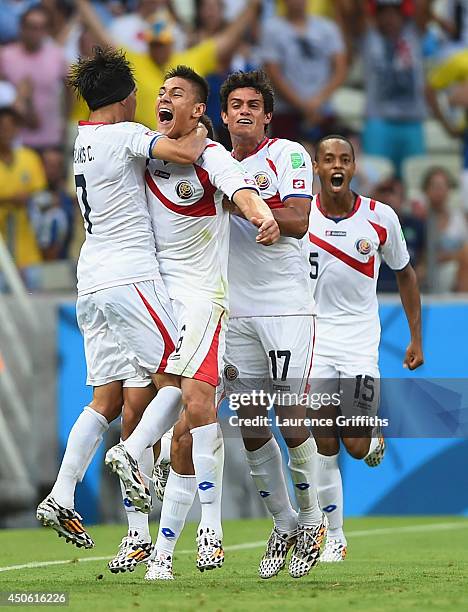 Oscar Duarte of Costa Rica celebrates scoring his team's second goal with teammates Christian Bolanos , Yeltsin Tejeda and Junior Diaz during the...