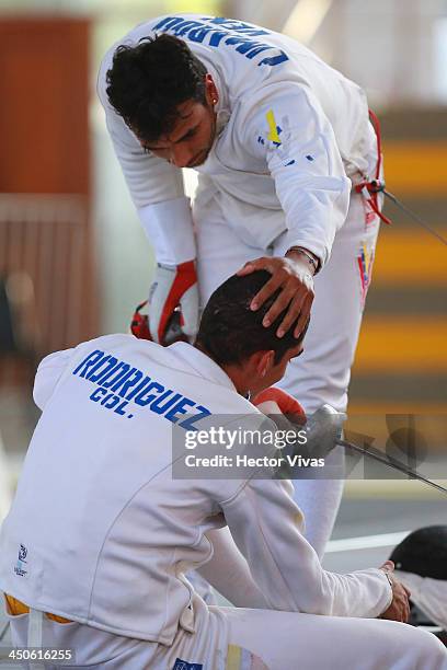 Jhon Rodriguez of Colombia competes with Francisco Limardo of Venezuela during a fencing event as part of the XVII Bolivarian Games Trujillo 2013 at...