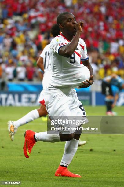 Joel Campbell of Costa Rica celebrates scoring his team's first goal with the ball under his jersey during the 2014 FIFA World Cup Brazil Group D...