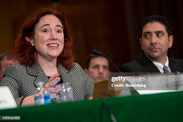 Mercedes Kelley Tunstall, partner with Ballard Spahr LLP, left, speaks during a Senate Banking Subcommittee hearing on virtual currency with Anthony...