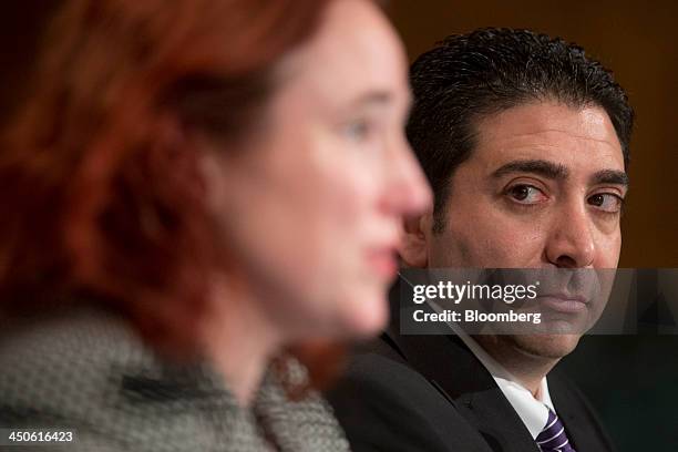 Anthony Gallippi, co-founder and chief executive officer of BitPay Inc., right, looks on as Mercedes Kelley Tunstall, partner with Ballard Spahr LLP,...