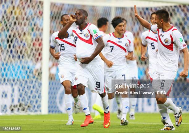 Joel Campbell of Costa Rica celebrates with team-mates after scoring the team's first goal during the 2014 FIFA World Cup Brazil Group D match...