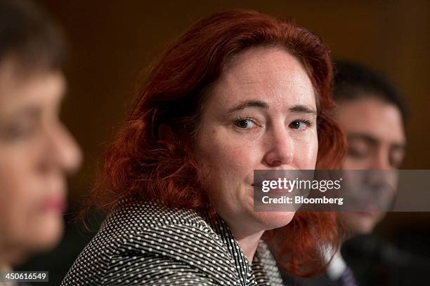 Mercedes Kelley Tunstall, partner with Ballard Spahr LLP, center, listens during a Senate Banking Subcommittee hearing on virtual currency in...