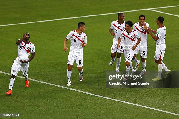 Joel Campbell of Costa Rica celebrates scoring his team's first goal with the ball under his jersey during the 2014 FIFA World Cup Brazil Group D...