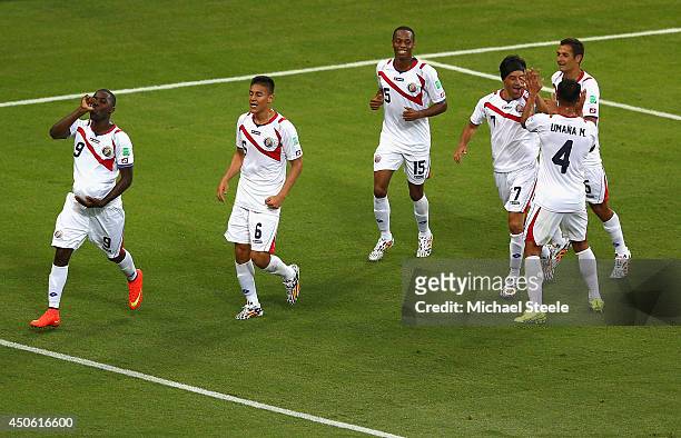 Joel Campbell of Costa Rica celebrates scoring his team's first goal with the ball under his jersey during the 2014 FIFA World Cup Brazil Group D...