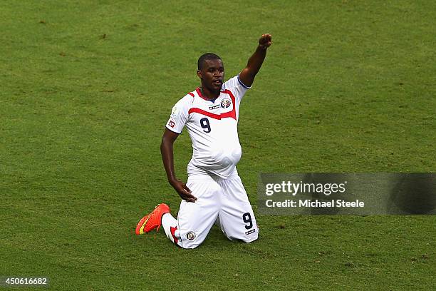 Joel Campbell of Costa Rica celebrates scoring his team's first goal with the ball under his jersey during the 2014 FIFA World Cup Brazil Group D...