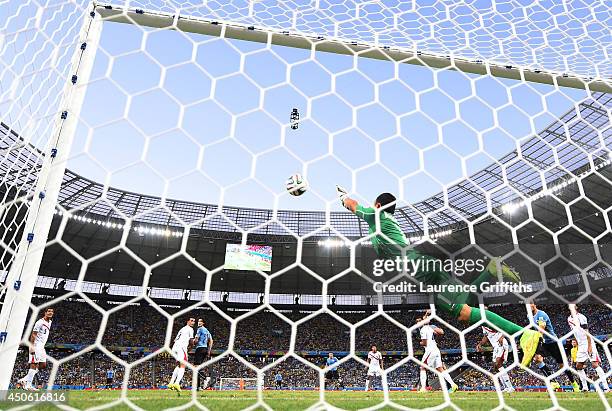 Keylor Navas of Costa Rica dives to make a save during the 2014 FIFA World Cup Brazil Group D match between Uruguay and Costa Rica at Castelao on...
