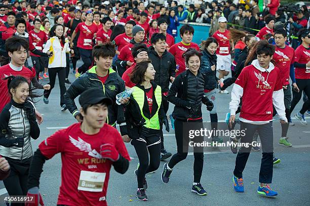 South Korean actors Park Su-Jin and Kim Sung-Eun attend a promotional event for 2013 NIKE 'We Run Seoul 10K' at Kwanghwamoon on November 17, 2013 in...