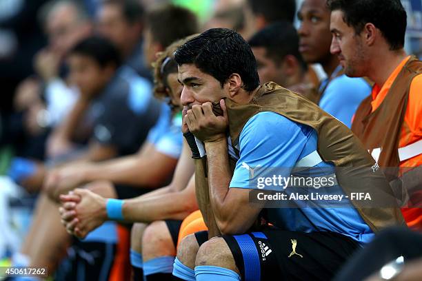 Luis Suarez of Uruguay watches from the bench during the 2014 FIFA World Cup Brazil Group D match between Uruguay and Costa Rica at Estadio Castelao...