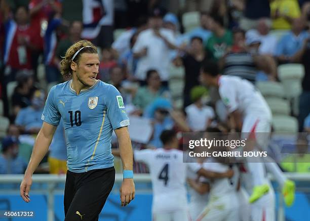 Uruguay's forward Diego Forlan walks over the pitch during a Group D football match between Uruguay and Costa Rica at the Castelao Stadium in...