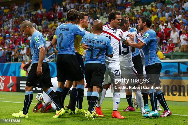 Scuffle breaks out between Uruguay and Costa Rica after a foul by Maximilliano Pereira of Uruguay during the 2014 FIFA World Cup Brazil Group D match...