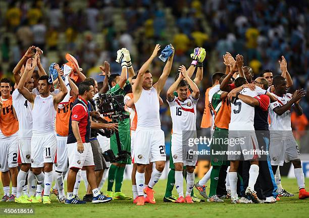 Costa Rica celebrate after defeating Uruguay 3-1 during the 2014 FIFA World Cup Brazil Group D match between Uruguay and Costa Rica at Castelao on...