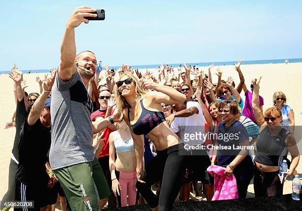 Team Workout personal trainers Chris and Heidi Powell and guests attend OK! Body & Soul 2014 at The Casa Del Mar Hotel on June 14, 2014 in Santa...