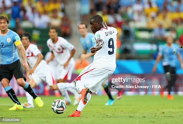Joel Campbell of Costa Rica scores the team's first goal during the 2014 FIFA World Cup Brazil Group D match between Uruguay and Costa Rica at...