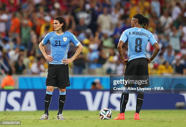 Edinson Cavani of Uruguay and Abel Hernandez of Uruguay show their dejection during the 2014 FIFA World Cup Brazil Group D match between Uruguay and...