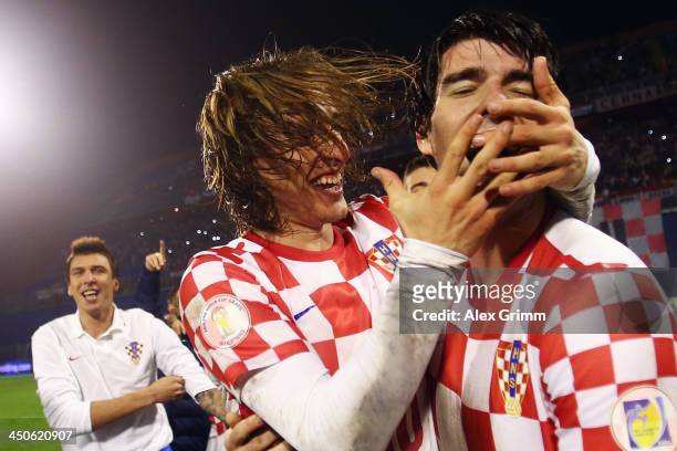 Luka Modric and Vedran Corluka of Croatia celebrate after the FIFA 2014 World Cup Qualifier play-off second leg match between Croatia and Iceland at...