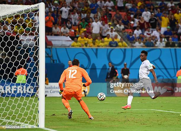 Daniel Sturridge of England shoots and scores his team's first goal past Salvatore Sirigu of Italy during the 2014 FIFA World Cup Brazil Group D...