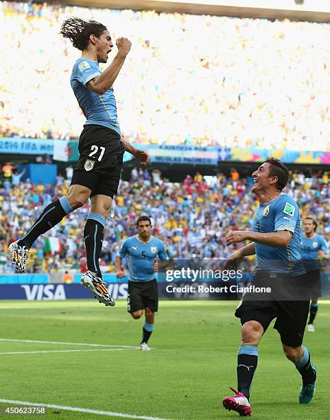Edinson Cavani of Uruguay celebrates scoring his team's first goal on a penalty kick during the 2014 FIFA World Cup Brazil Group D match between...
