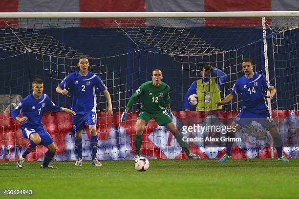 Johann Gudmundsson, Kristinn Jonsson, Hannes Halldorsson and Kari Arnason of Iceland look on during the FIFA 2014 World Cup Qualifier play-off second...