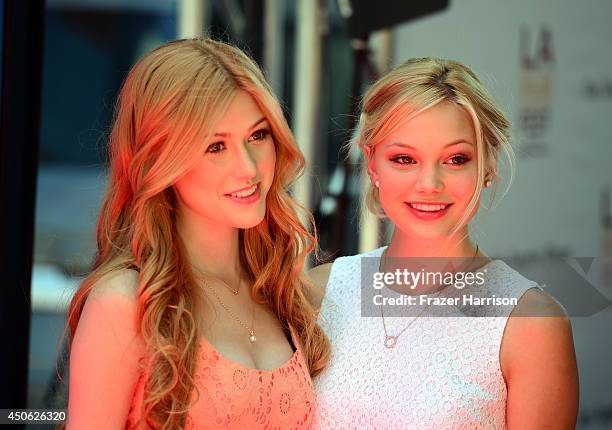 Actresses Katherine McNamara and Olivia Holt attend the premiere of "Earth to Echo" during the 2014 Los Angeles Film Festival at Premiere House on...