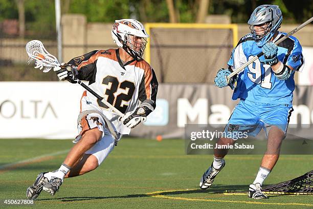 Jordan Wolf of the Rochester Rattlers controls the ball in the fourth quarter as Dana Wilber of the Ohio Machine defends on June 14, 2014 at Selby...
