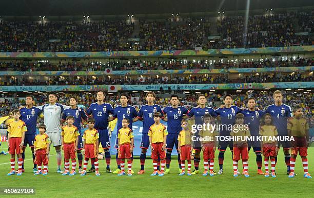 The Japanese national team Japan's midfielder and captain Makoto Hasebe, Japan's goalkeeper Eiji Kawashima, Japan's defender Maya Yoshida, Japan's...