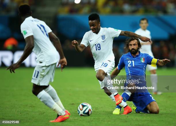 Raheem Sterling of England dribbles past Andrea Pirlo of Italy during the 2014 FIFA World Cup Brazil Group D match between England and Italy at Arena...