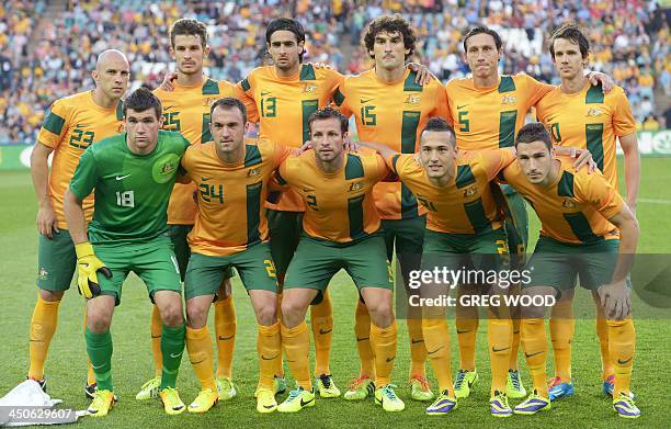In this photo taken on November 19, 2013 Australian football players Mark Bresciano, Dario Vidosic, Rhys Williams, Mile Jedinak, Mark Milligan and...