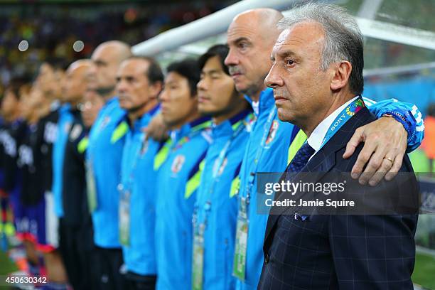 Head coach Alberto Zaccheroni of Japan looks on with his team during the 2014 FIFA World Cup Brazil Group C match between the Ivory Coast and Japan...