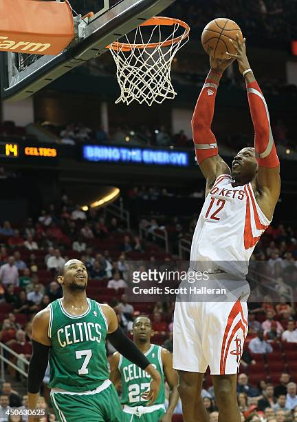 Dwight Howard of the Houston Rockets shoot over Jared Sullinger of the Boston Celtics at the Toyota Center on November 19, 2013 in Houston, Texas....