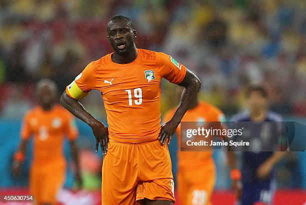 Yaya Toure of the Ivory Coast looks on in the rain during the 2014 FIFA World Cup Brazil Group C match between the Ivory Coast and Japan at Arena...
