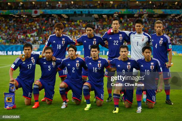 Japan pose for a team photo before the 2014 FIFA World Cup Brazil Group C match between the Ivory Coast and Japan at Arena Pernambuco on June 14,...