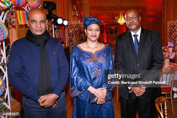 The negotiator for the release of French hostages in Arlit, Mohamed Akotey and Ambassador of Niger Abderahamane Assane Mayaki with his wife attend...