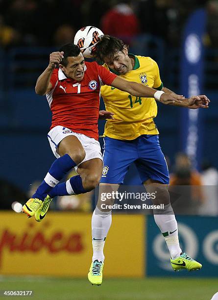 Alexis Sanchez from Chile and Maxwell go up for a ball as Chile and Brazil play in an international soccer friendly at Rogers Centre in Toronto....