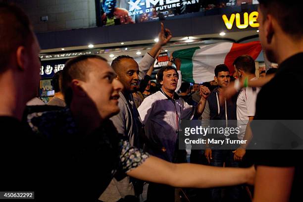English and Italian football fans taunt each other in Leicester Square after Italy beat England 2-1 in their opening game of the 2014 FIFA World Cup...