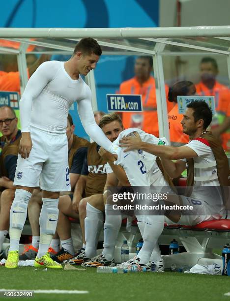Frank Lampard of England helps Ross Barkley with his jersey during the 2014 FIFA World Cup Brazil Group D match between England and Italy at Arena...